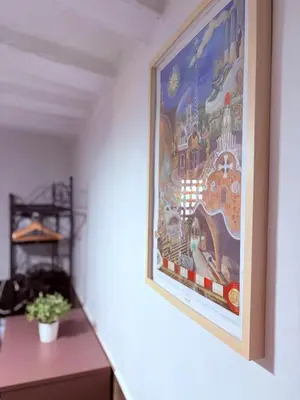 a painting hanging on a wall in a room at Stunning flat for 6 people 3 blocks from the beach plus welcome breakfast in Barcelona