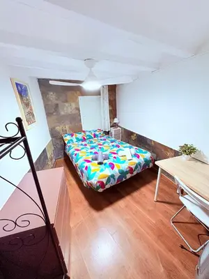a bedroom with a bed in a room at Stunning flat for 6 people 3 blocks from the beach plus welcome breakfast in Barcelona