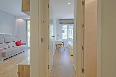 a living room with a couch and a table at Habitat Apartments Pau in Barcelona