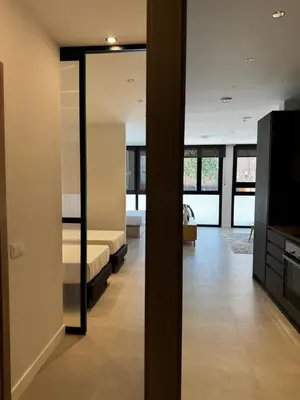 a living room with a couch and a television at Comfortwork near Barcelona in Sant Quirze del Vallès