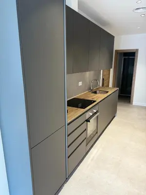a kitchen with gray cabinets and a sink at Comfortwork near Barcelona in Sant Quirze del Vallès