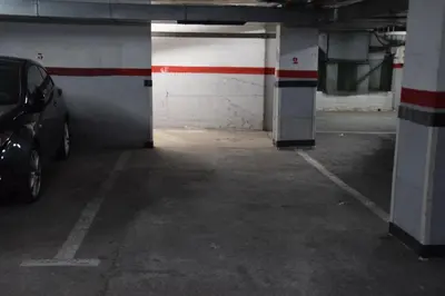 a parking garage with a car parked in it at Apartamento nuevo en Calella totalmente reformado con Parking privado in Calella
