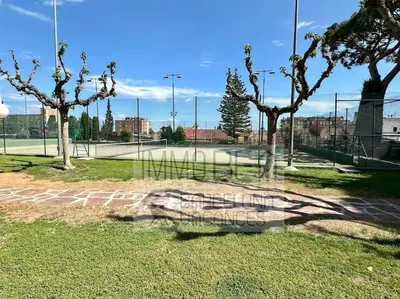 a tennis court with trees on a tennis court at BV-SV-002-Mediterrani in Sant Andreu de Llavaneres