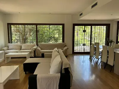 a living room with a couch and a table at Vivenda de luxe a Barcelona in Sant Cugat del Vallès