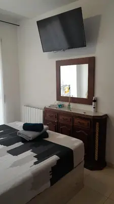 a small bathroom with a washing machine in it at STUDIO VILAFRANCA DEL PENEDES in Vilafranca del Penedès