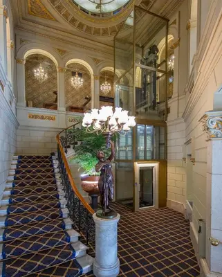 a statue of a woman on a pedestal in a lobby at Hotel Continental Palacete in Barcelona