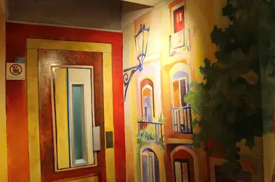 a room with a painting on the wall and a door at Apartaments Ciutat Vella in Barcelona