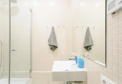 a bathroom with a sink and a shower at Canela Homes BARCELONA GÒTIC in Barcelona