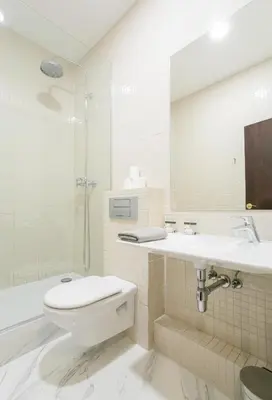a bathroom with a toilet and a sink and a shower at Canela Homes BARCELONA GÒTIC in Barcelona