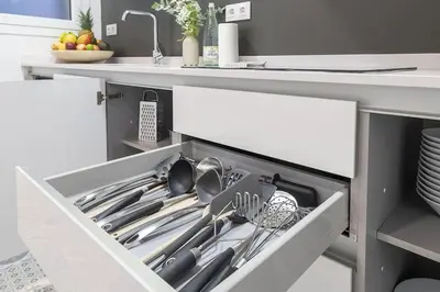 a drawer in a kitchen with utensils in it at Canela Homes BARCELONA STYLE in Barcelona