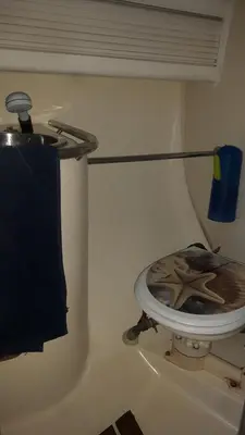 a bathroom with a toilet in the corner of a room at COSY BOAT FLAT at BARCELONA BEACH in Barcelona