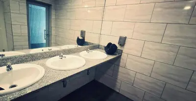 a bathroom with three sinks and a mirror at COSY BOAT FLAT at BARCELONA BEACH in Barcelona