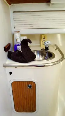 a bathroom with a sink and mitts next to it at COSY BOAT FLAT at BARCELONA BEACH in Barcelona