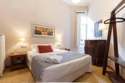 a bedroom with a bed with towels on it at AinB B&B Born-Via Laietana in Barcelona