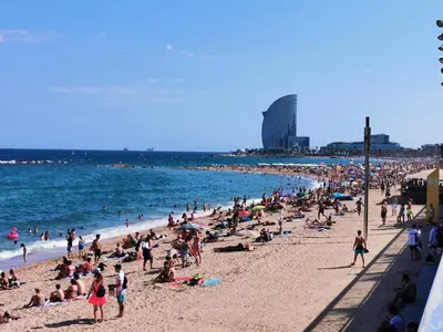 a large crowd of people on a beach at ClassBedroom Barcelona Beach Apartments in Barcelona