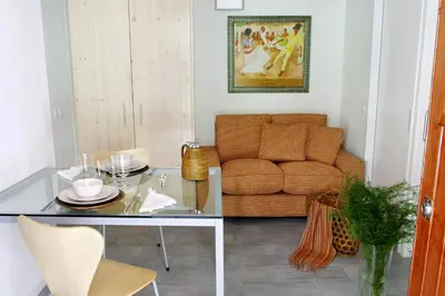 a living room with a glass table and a couch at ClassBedroom Barcelona Beach Apartments in Barcelona