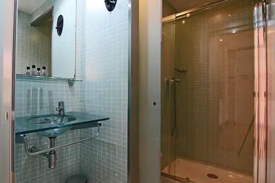 a bathroom with a sink and a shower at ClassBedroom Barcelona Beach Apartments in Barcelona
