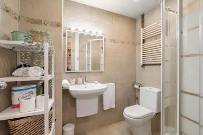 a small bathroom with a toilet and a sink at OASIS BEACH-CITY apartment in Montgat