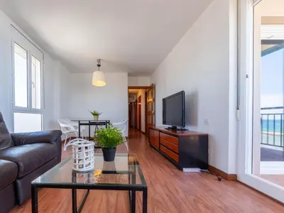 a living room with a couch and a tv at Apartment Garbi by Interhome in Cunit