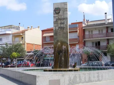 a water fountain in front of a building at GARDEN'S SEA PiNEDA DE MAR in Pineda de Mar