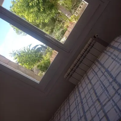 a window in a room with a shower curtain at Ca La Montserrat - Wine Rural House in San Martín Sarroca