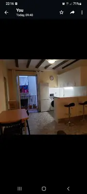 a view of a kitchen with a table and a table and chairs at Apartment in Downtown 2 bedrooms AC 30 nigths min in Barcelona