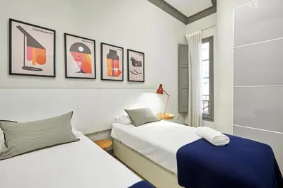 a bedroom with two beds and a window at 