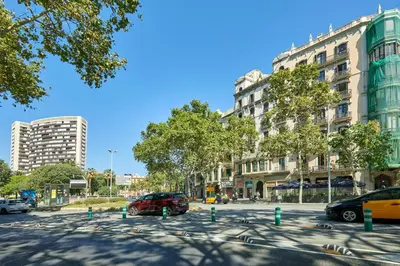 a city street with cars parked in a parking lot at 
