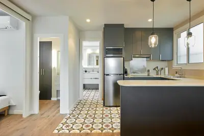 a kitchen with a sink and a counter top at 