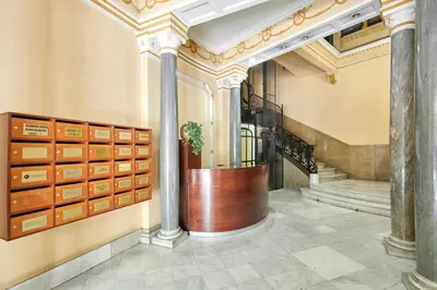 a hallway with lockers and a staircase in a building at 