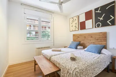 a bedroom with two beds and a table at 