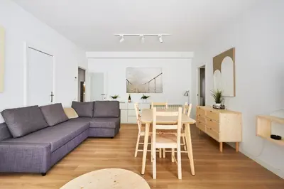 a living room with a couch and a table at 