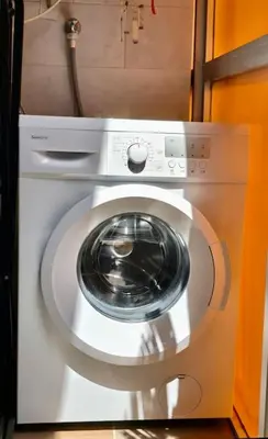 a white washing machine with a door in a room at Penthouse 100m from Sea with Terrace, Near BCN in Mataró