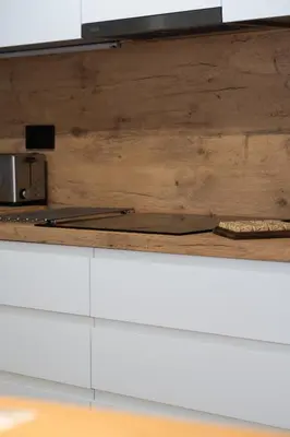 a kitchen counter with a cutting board and a knife at Apartamento Granollers in Granollers