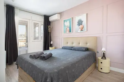 a bedroom with a bed with two pillows on it at Fantastic view penthouse apartment in Barcelona