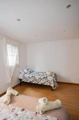 a bedroom with two beds and a window at 2 bedroom apartment Barcelona Center in Barcelona