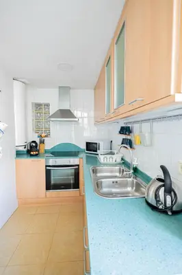 a large kitchen with a sink and a sink at 2 bedroom apartment Barcelona Center in Barcelona