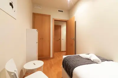 a bedroom with a bed and a mirror at 2762 - AB Park Guell Apartment B-II in Barcelona