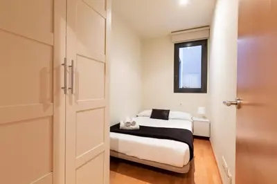 a living room with a couch and a tv at 2762 - AB Park Guell Apartment B-II in Barcelona