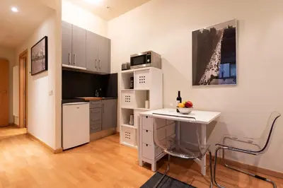 a small bedroom with a bed and a window at 2762 - AB Park Guell Apartment B-II in Barcelona