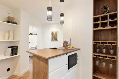 a kitchen with a wooden counter top in a room at Enjoy Apartments La Riera Principal in Barcelona