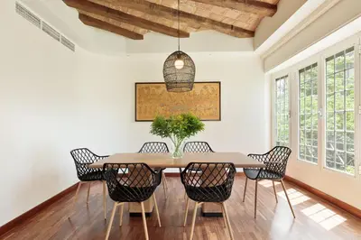 a dining room with a table and chairs at Enjoy Apartments La Riera Principal in Barcelona