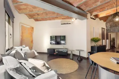 a living room with a couch and a table at Enjoy Apartments Urban Retreat Valencia 1 in Barcelona