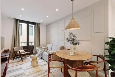 a bedroom with a bed and a desk at Pompei - 2 bedrooms, balcony and terrace in Ciutat Vella in Barcelona