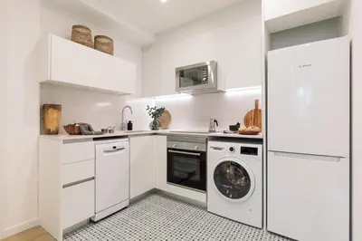 a living room with a couch and a tv at Pompei - 2 bedrooms, balcony and terrace in Ciutat Vella in Barcelona