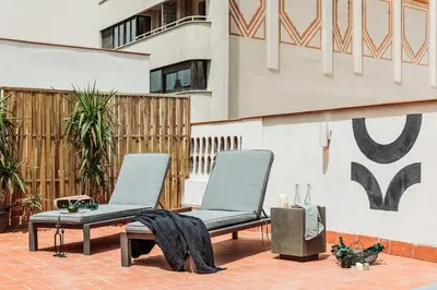 two chairs and a table on a patio at Pompei - 2 bedrooms, balcony and terrace in Ciutat Vella in Barcelona