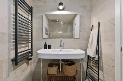 a bedroom with a bed and a green wall at Zamora - 3 bedrooms in Eixample Esquerra in Barcelona