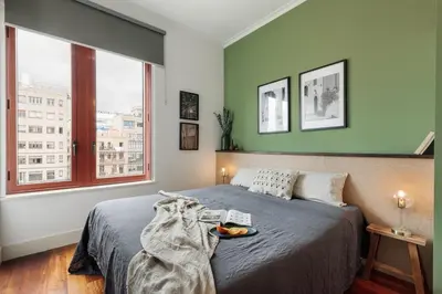 a desk with a chair and a lamp at Zamora - 3 bedrooms in Eixample Esquerra in Barcelona
