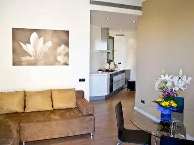 a living room with a couch and a glass table at Flat with views to Sagrada Famila in Barcelona