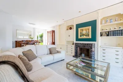 a living room with a couch and a fireplace at Casa Nina junto Barcelona Centro y playa in Teià